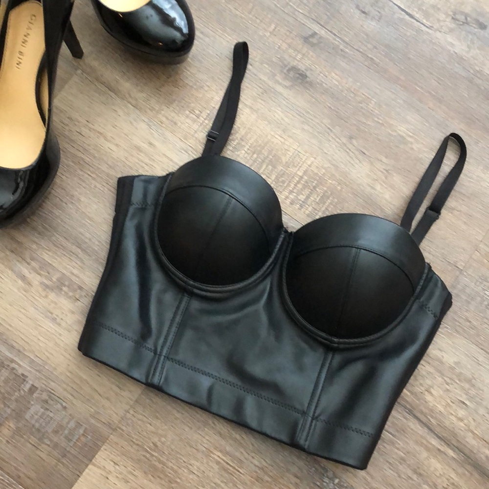 Adjustable straps and clasp. Can be a shirt or bra.